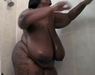 This Big ebony female drains in the shower. Her meaty ebony