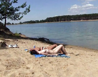 2 steamy russian maiden getting a suntan on the free beach.