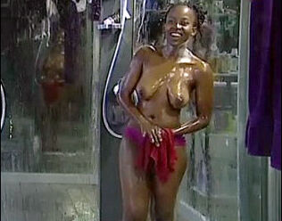 Buxom african lady bare-breasted in bathroom with dude,