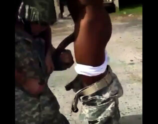 Soldier compelled to fellate dark-hued prick